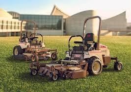 Operator using Grasshopper mower on commercial property