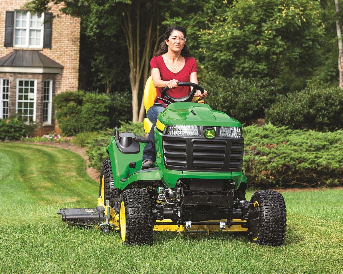 Lineup of tractors and mowers ready for service